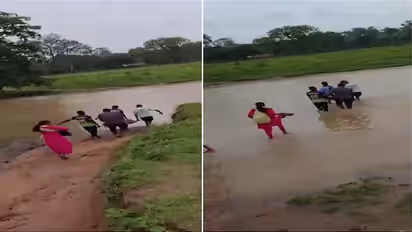 Pregnant woman carried on cot through flooded stream in Maharashtra