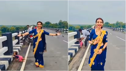 Woman Films Reel as Baby Crawls Toward Bridge Edge, Stranger Rushes to Rescue