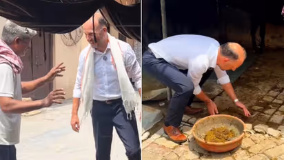 German Diplomat Experiences Rural India, Feeds Cows and Tries Farm Work