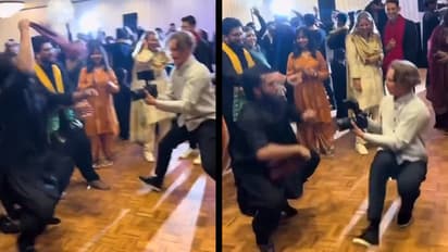 wedding-photographer-dances-with-guest