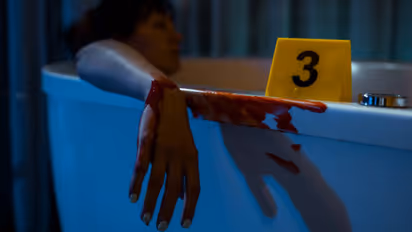 Woman's dead body in bathroom