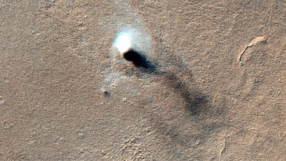  Dust devil, whirlwind of dust is blown across Mars’ surface