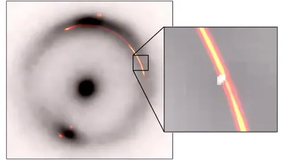 Infrared and radio images reveal tiny dark gravitational lens effect