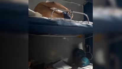 Shirtless Man Handcuffed in Rajdhani Express 