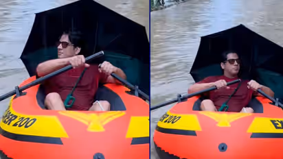 Actor travels by boat in Mumbai rain