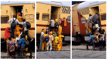 Indian railway passengers rushing to board the train
