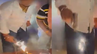 delhi man cutting birthday cake with gun