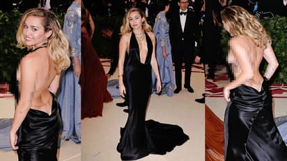 Miley Cyrus goes braless and has an 'oops' moment in a low cut backless gown. Take a look