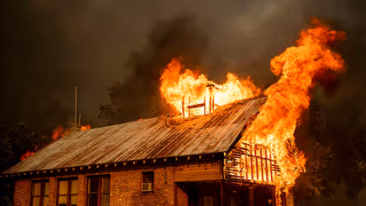 California wildfire burns homes, injures firefighters, civilians