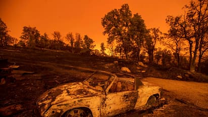 California wildfire destroys 500 structures, nearly levels community