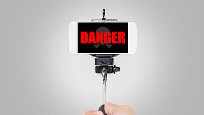 Mumbai boy on moving train steals phone to make viral video