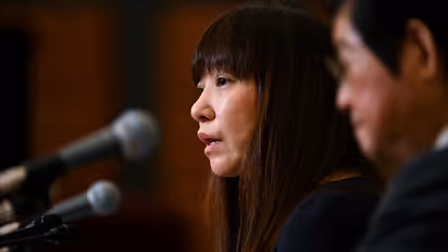 Wife of missing Japanese journalist makes tearful appeal for his release