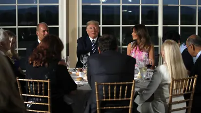 Donald Trump, at golf club, intent on projecting he's hard at work
