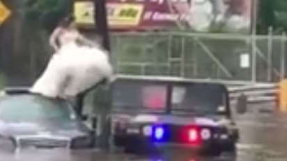 വെള്ളപ്പൊക്കത്തിൽ കാറിന് മുകളിൽ അകപ്പെട്ട വധുവിനെ പൊലീസ് രക്ഷപ്പെടുത്തി