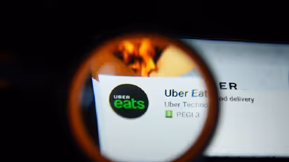 Customer orders from Uber Eats, deliveryman takes a stealthy bite