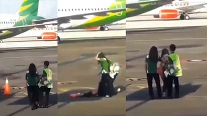 വിമാനത്തിൽ ഓടിക്കയറാൻ ശ്രമിക്കുന്ന യാത്രക്കാരി; വീഡിയോ കാണാം