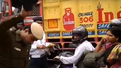 ನಡು ರಸ್ತೆಯಲ್ಲಿ ಮಹಿಳೆ ಹೆಲ್ಮೆಟ್ ಪುಡಿ ಮಾಡಿ ಸರ್ಪ್ರೈಸ್ ನೀಡಿದ ಪೊಲೀಸ್!