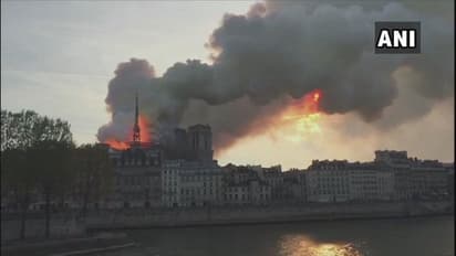 Notre-Dame Cathedral blaze: Parisians console each other amid talks of rebuilding