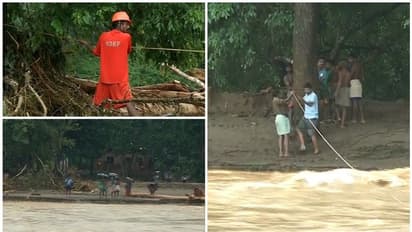 മുണ്ടേരിയിൽ കുടുങ്ങിയത് 220 ആദിവാസികൾ: കയറുകെട്ടി ഭക്ഷണമെത്തിച്ച് ഫയർഫോഴ്സ്