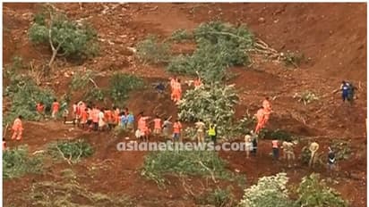 കവളപ്പാറയിൽ മൺകൂനകൾ ചൂണ്ടിക്കാണിച്ച് ബന്ധുക്കൾ, മരണം 14, ഇനി കണ്ടെത്താനുള്ളത് 51 പേരെ