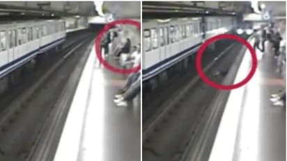 మెట్రో స్టేషన్ లో మహిళ నిర్వాకం... ఫోన్ చుస్తూ.. పట్టాలపైకి(వీడియో)