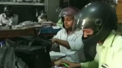 ഓഫീസിനുള്ളിൽ ഹെൽമെറ്റ് ധരിച്ച് വൈദ്യുതി വകുപ്പിലെ ഉദ്യോഗസ്ഥർ; കാരണം ഇതാണ്