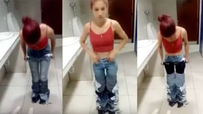 ഒന്നിന് മുകളിൽ ഒന്നായി ധരിച്ചത് എട്ട് ജീൻസുകൾ; മോഷണശ്രമത്തിനിടെ യുവതി പിടിയിൽ-വീഡിയോ