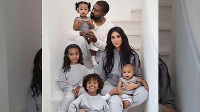 Kim Kardashian poses with husband Kanye West along with children for Christmas card