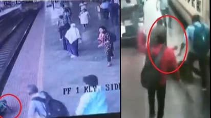 కదులుతున్న రైలు ఎక్కబోయి.. ట్రాక్ మధ్యలో పడిన మహిళ.. వీడియో