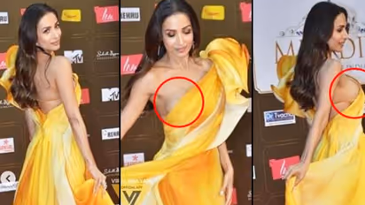 Watch: Malaika Arora risks wearing one-shoulder thigh-slit satin gown