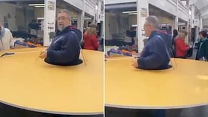 കൊവിഡ് 19: ആളുകളെ അകറ്റിനിർത്താൻ 'കാർഡ്ബോർഡ് ഡിസ്ക്' ധരിച്ച് മധ്യവയസ്കൻ- വീഡിയോ വൈറൽ