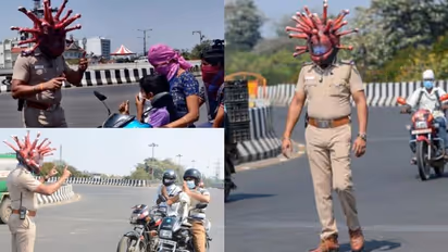 ലോക്ക് ഡൗണിൽ തെരുവിലിറങ്ങി ആളുകൾ; ബോധവത്ക്കരണത്തിന് 'കൊറോണ ഹെൽമെറ്റ്' ധരിച്ച് പൊലീസ്, വേറിട്ട മാതൃക