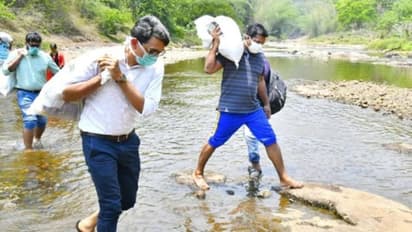 గిరిజనుల కోసం... అడవిలో కాలినడక: నిత్యావసరాలను భుజాలపై మోసిన కలెక్టర్, ఎమ్మెల్యే