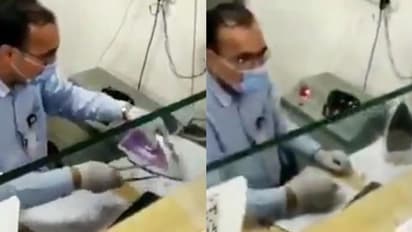 'ഗോ കൊറോണേ..'; കൊവിഡിനെ ഓടിക്കാൻ ചെക്ക് 'തേച്ചെടുത്ത്' ബാങ്ക് ജീവനക്കാരൻ, വീഡിയോ വൈറൽ !