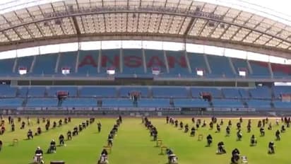 Coronavirus: Watch how job applicants sit 5 metres apart to write exam at South Korea football stadium