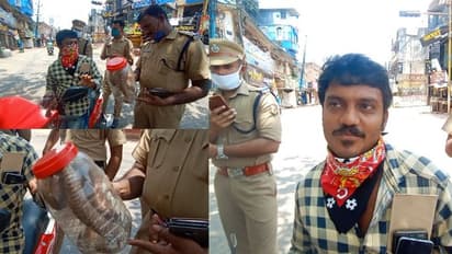 ലോക്ക് ഡൗണിനിടെ മൂർഖനെ കുപ്പിയിൽ 'ലോക്കാക്കി' ബൈക്ക് യാത്രികൻ, വളഞ്ഞ് പൊലീസ്, പിന്നാലെ കൗതുകം