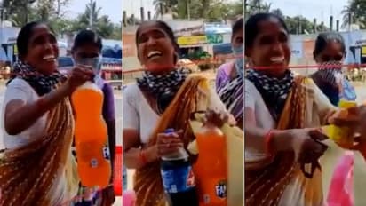 'ദാഹമകറ്റാൻ....';പൊരിവെയിലിൽ നിരത്തുകളിൽ ജോലി നോക്കുന്ന പൊലീസുകാർക്ക് കൂൾ ഡ്രിംങ്സുമായെത്തി സ്ത്രീ, കയ്യടി