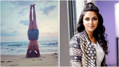 அரைகுறை ஆடையில் பீச்சில் தலைகீழாக நிற்கும் அமலா பால்... வைரலாகும் ஹாட் கிளிக்ஸ்...!