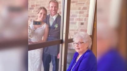 ചില്ലുവാതിലിനിപ്പുറം നിന്ന് മുത്തശ്ശിയുടെ അനുഗ്രഹം വാങ്ങി; ഇത് കൊറോണക്കാലത്തെ വിവാഹം !