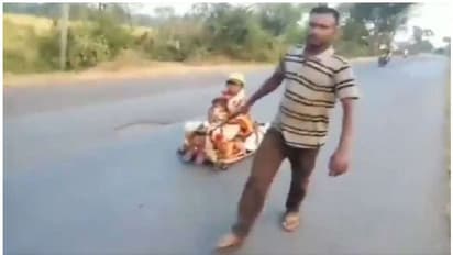 തടിയും കമ്പും കൊണ്ട് ഉന്തുവണ്ടിയുണ്ടാക്കി, ഗർഭിണിയായ ഭാര്യയെ ഇരുത്തി 700 കിലോമീറ്റർ യാത്ര; വീഡിയോ