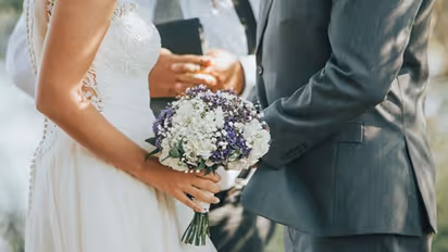 Awkward! Groom grabs bride's buttocks while preacher prays at wedding; video goes viral