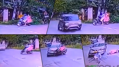 വെട്ടിച്ചു, ബ്രേക്കിട്ടു; എന്നിട്ടും ഇടറോഡില് നിന്നെത്തിയ സ്കൂട്ടറിനെ കാര് ഇടിച്ചിട്ടു!