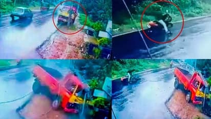 നനഞ്ഞ റോഡ് ചതിച്ചു, ടിപ്പര്‍ പോസ്റ്റ് തകര്‍ത്തു, ഇലക്ട്രിക്ക് ലൈനില്‍ കുടുങ്ങി ബൈക്ക് യാത്രികന്‍!