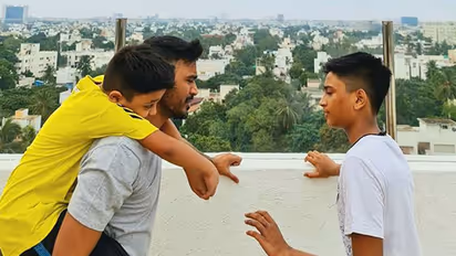Dhanush's adorable moment with sons Linga and Yatra goes viral