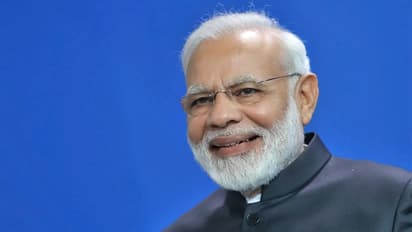 PM Modi’s witty reply to Milind Soman’s birthday wish viciously trolls Opposition