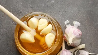 Eat honey coated garlic on empty stomach to boost weight loss