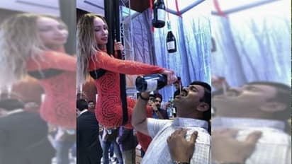 লাস্যময়ী রুশ সুন্দরী মদ ঢেলে দিচ্ছে মুখে, বুক বাজিয়ে সাংসদ বললেন 'আমারই ছবি'