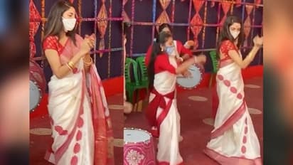 শাঁখা পলা, লাল পাড় সাদা শাড়ি, ঢাকের তালে পুজোর মণ্ডপে জমল নুসরতের নাচ