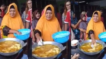 തിളച്ച എണ്ണയിൽ കയ്യിട്ട് ഭക്ഷണം വറുത്തെടുക്കുന്ന സ്ത്രീ; വീഡിയോ വൈറല്