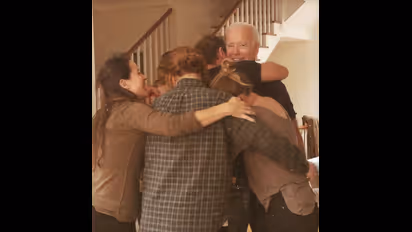 Group hug: Biden's grand-daughter captures the winning moment